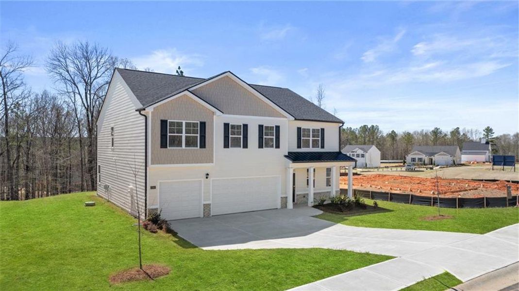 Front exterior of a new home in Kingston Ranch at Lake Oconee, Buckhead, GA, highlighting curb appeal (Image 27).