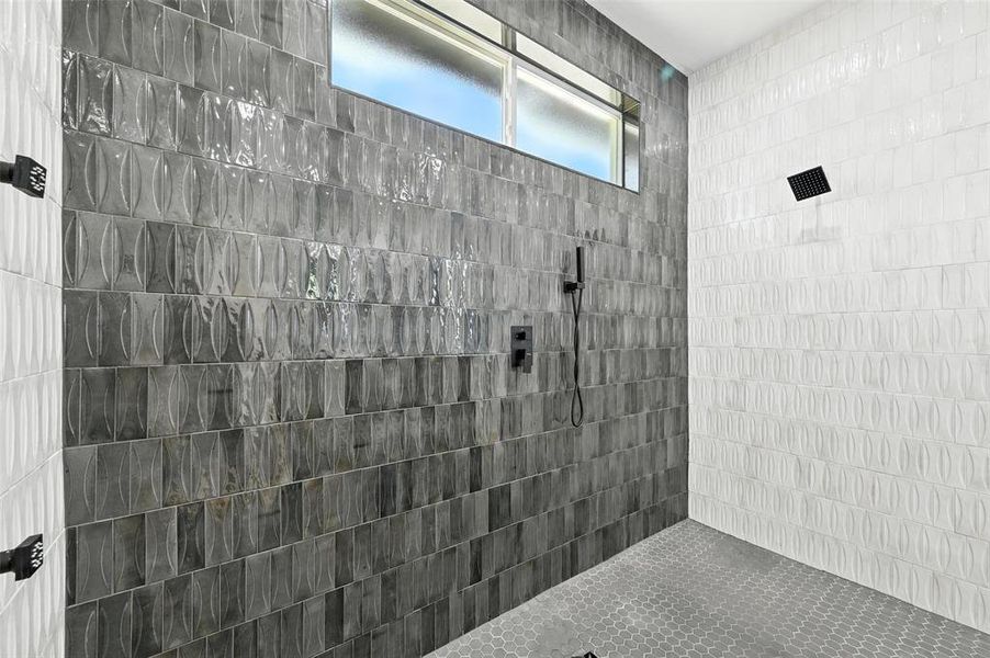 Full bath featuring a tile shower Full bath featuring a tile shower