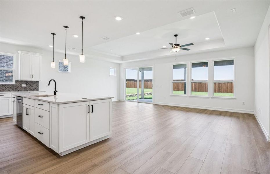 Large island overlooking gathering room and dining areas Large island overlooking gathering room and dining areas