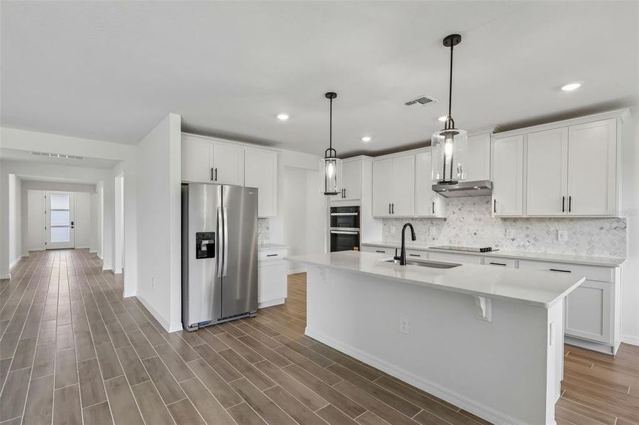 Furnished interior view inside a new home in The Grove at Stuart Crossing - Signature Series, Bartow (Image 8).