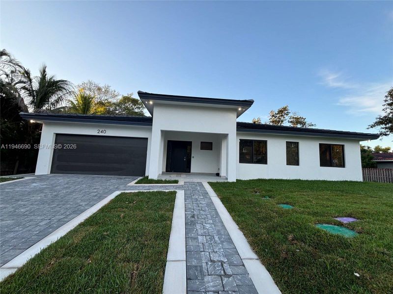 Front exterior of a new home in , Miami, FL, highlighting curb appeal (Image 1). Front exterior of a new home in , Miami, FL, highlighting curb appeal (Image 1).