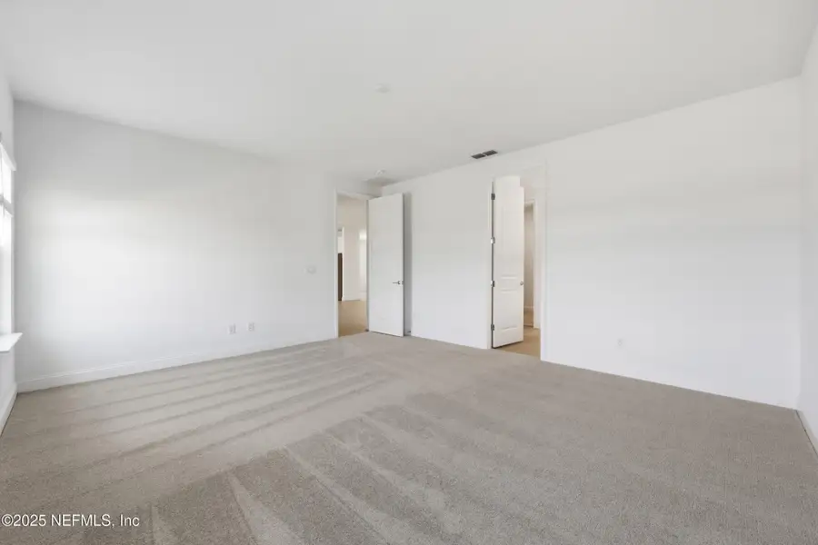 Spacious, unfurnished interior of a new home in Edenbrooke at Hyland Trail | 55+: Edenbrooke at Hyland Trail 60s, Green Cove Springs (Image 18). Spacious, unfurnished interior of a new home in Edenbrooke at Hyland Trail | 55+: Edenbrooke at Hyland Trail 60s, Green Cove Springs (Image 18).