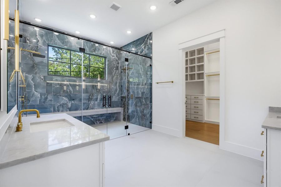 This grand primary shower is something you can't miss as you enter the spa style primary bath.