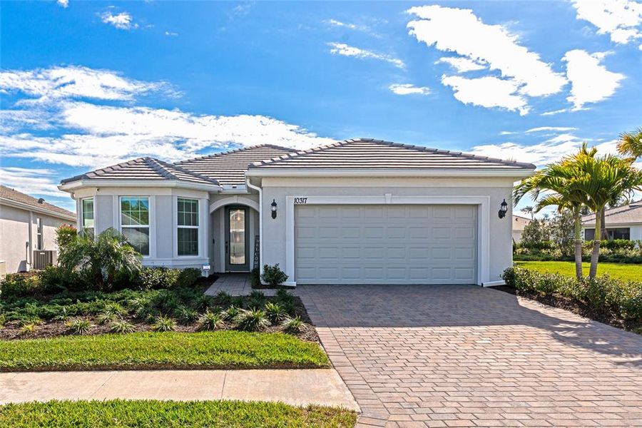 Front exterior of a new home in , Englewood, FL, highlighting curb appeal (Image 25). Front exterior of a new home in , Englewood, FL, highlighting curb appeal (Image 25).