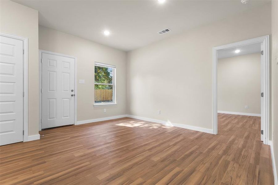 Spare room with light wood-type flooring and recessed lighting Spare room with light wood-type flooring and recessed lighting