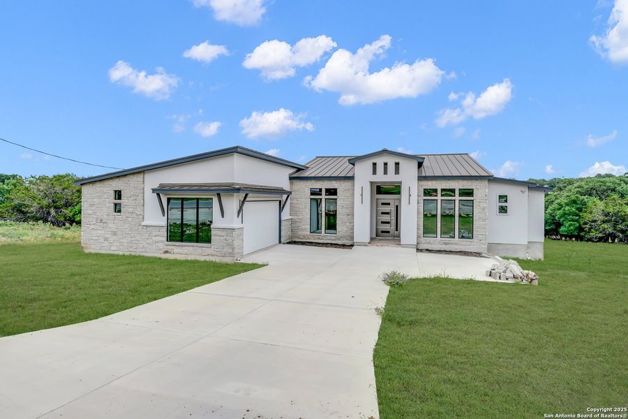 Front exterior of a new home in , Spring Branch, TX, highlighting curb appeal (Image 20). Front exterior of a new home in , Spring Branch, TX, highlighting curb appeal (Image 20).