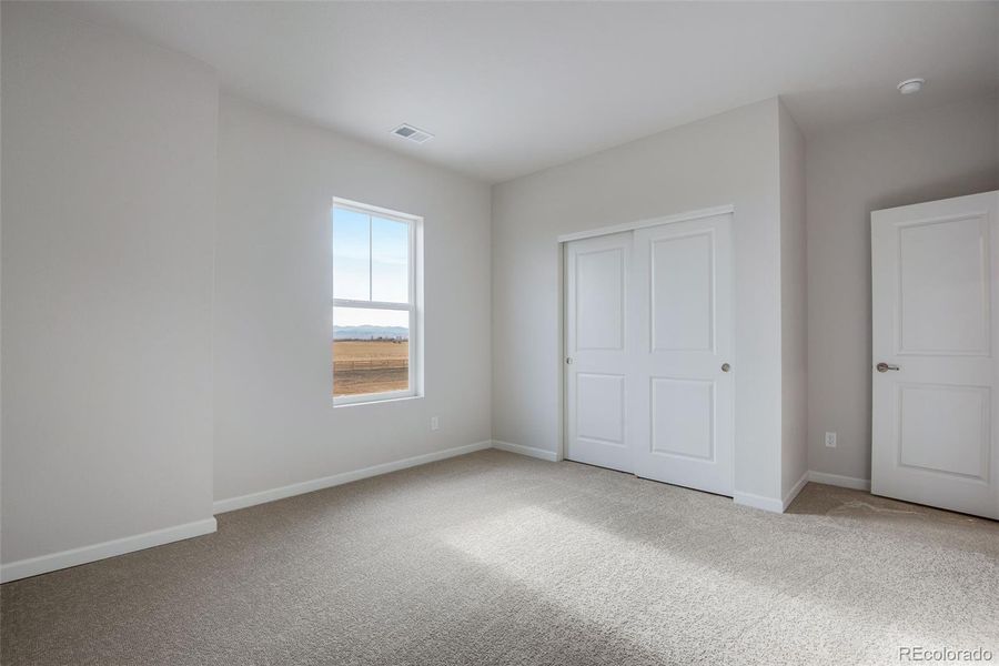 Spacious, unfurnished interior of a new home in Medley at Reunion Ridge, Commerce City (Image 40).