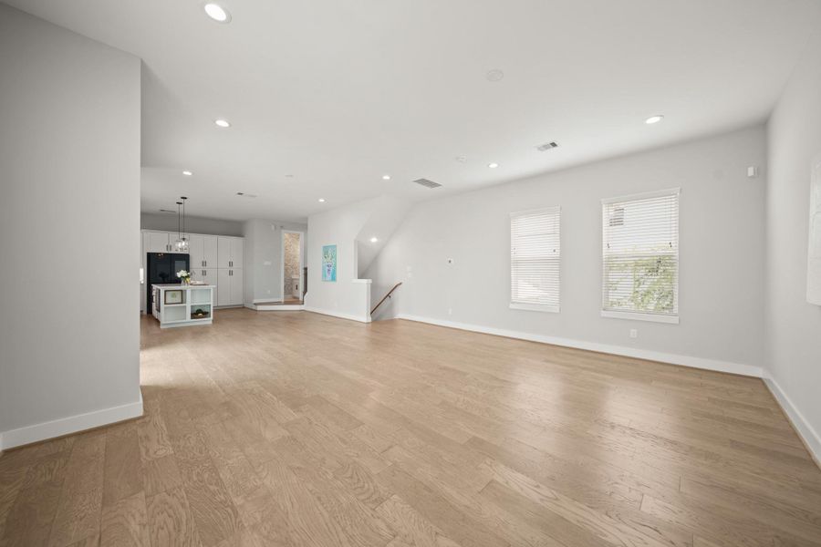 With wide plank hardwood flooring throughout, it adds warmth and elegance to the space. With wide plank hardwood flooring throughout, it adds warmth and elegance to the space.