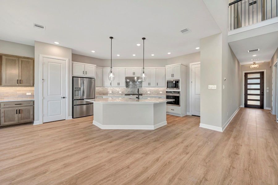 Furnished interior view inside a new home in COLTON - Reserve Collection, Todd Mission (Image 19).