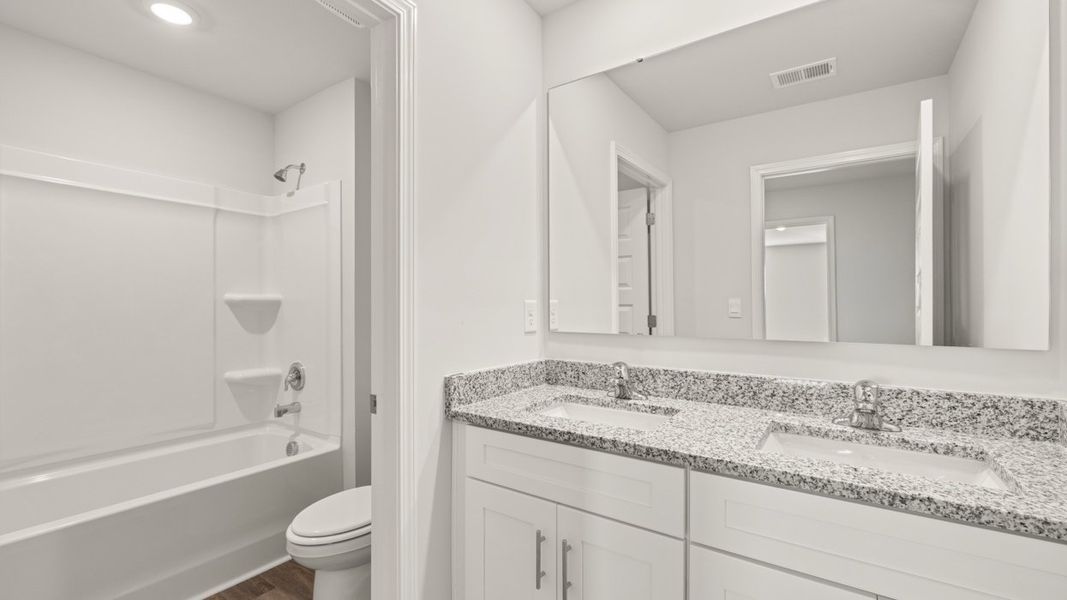 Representative furnished interior of a home built from the Mansfield by D.R. Horton in Southwind Village, Evans (Image 15).