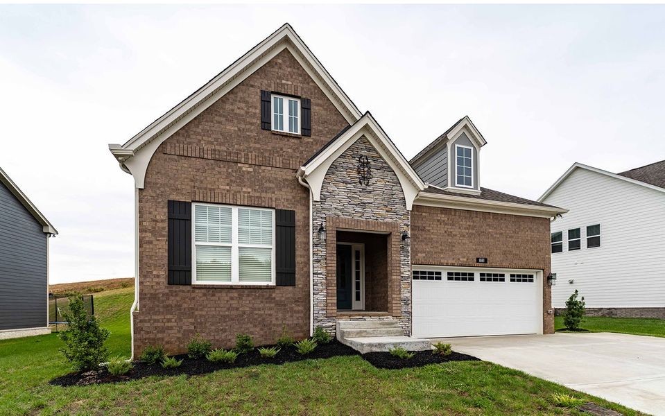 Front exterior of a new home in The Retreat at Norman Farm, Hendersonville, TN, highlighting curb appeal (Image 19). Front exterior of a new home in The Retreat at Norman Farm, Hendersonville, TN, highlighting curb appeal (Image 19).