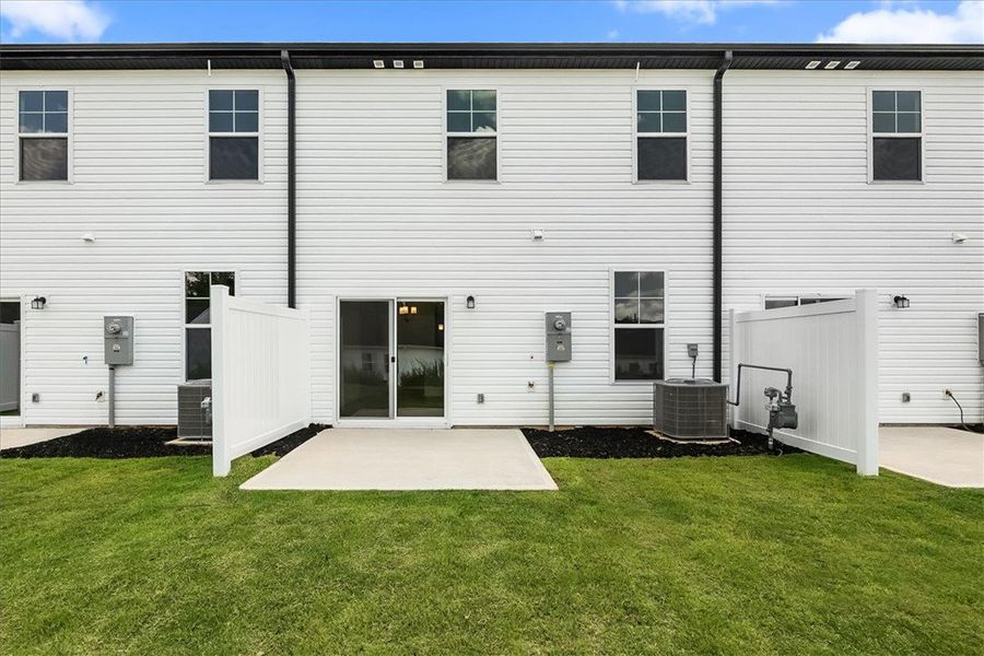 Exterior details and patio area of a home in Meece Townhomes, Easley (Image 2). Exterior details and patio area of a home in Meece Townhomes, Easley (Image 2).