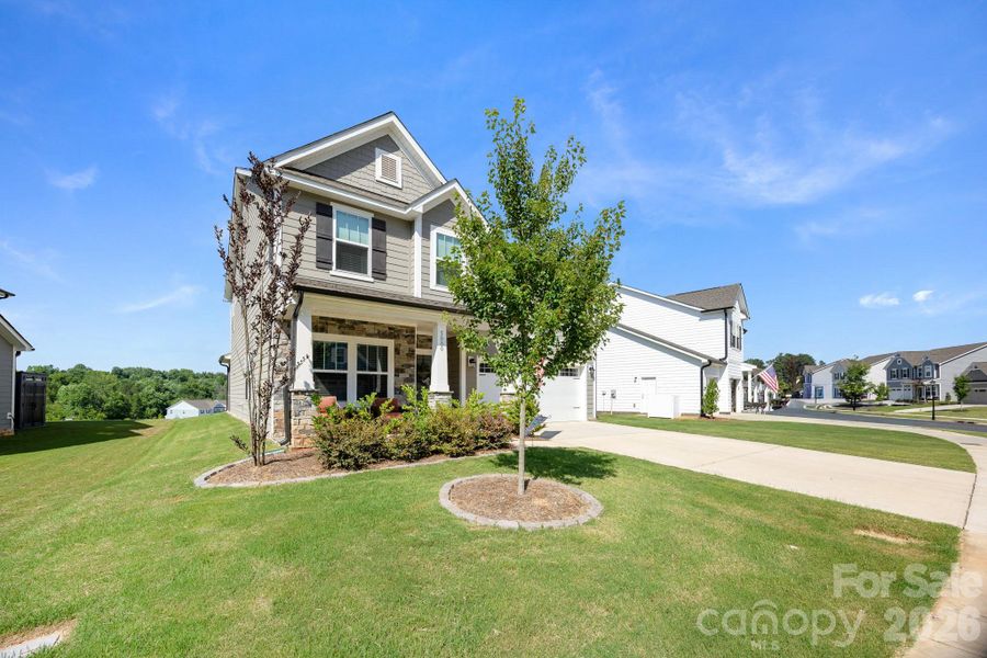Front exterior of a new home in , Mount Holly, NC, highlighting curb appeal (Image 26).