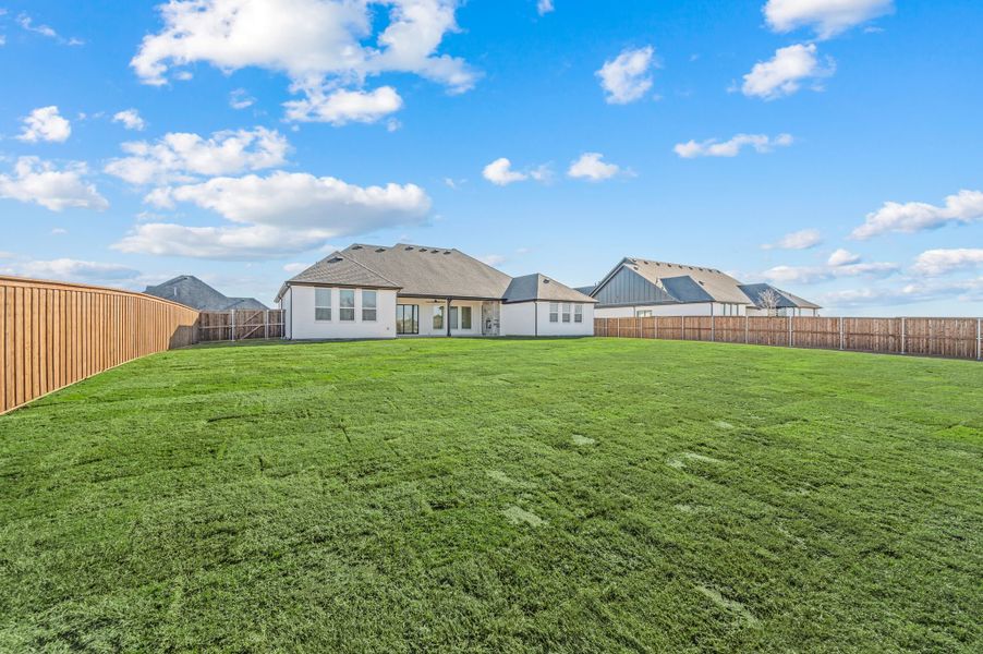 Exterior details and patio area of a home in NorthGlen, Haslet (Image 28).