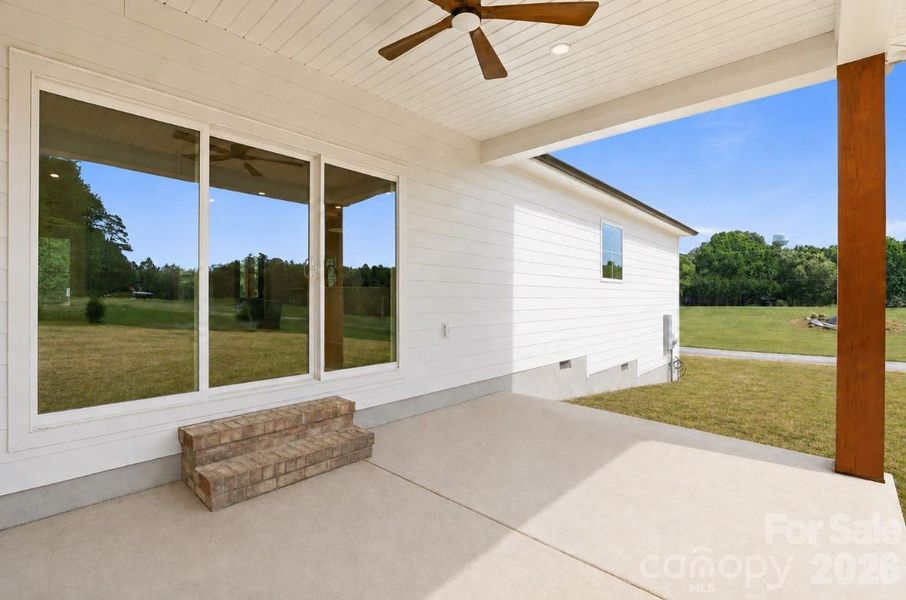 covered back patio w/ solid oak post & ceiling fan*yard virtually updated covered back patio w/ solid oak post & ceiling fan*yard virtually updated