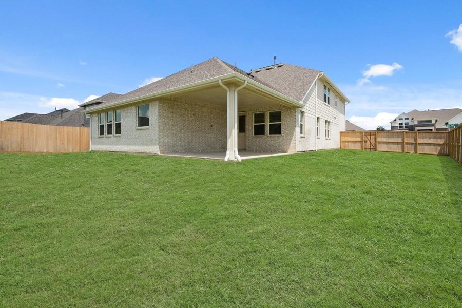 Exterior details and patio area of a home in Westland Ranch - 70' Homesites, League City (Image 1).