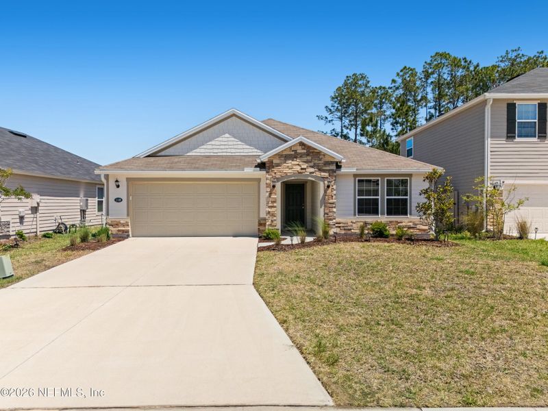 Front exterior of a new home in Copper Ridge, Jacksonville, FL, highlighting curb appeal (Image 26).