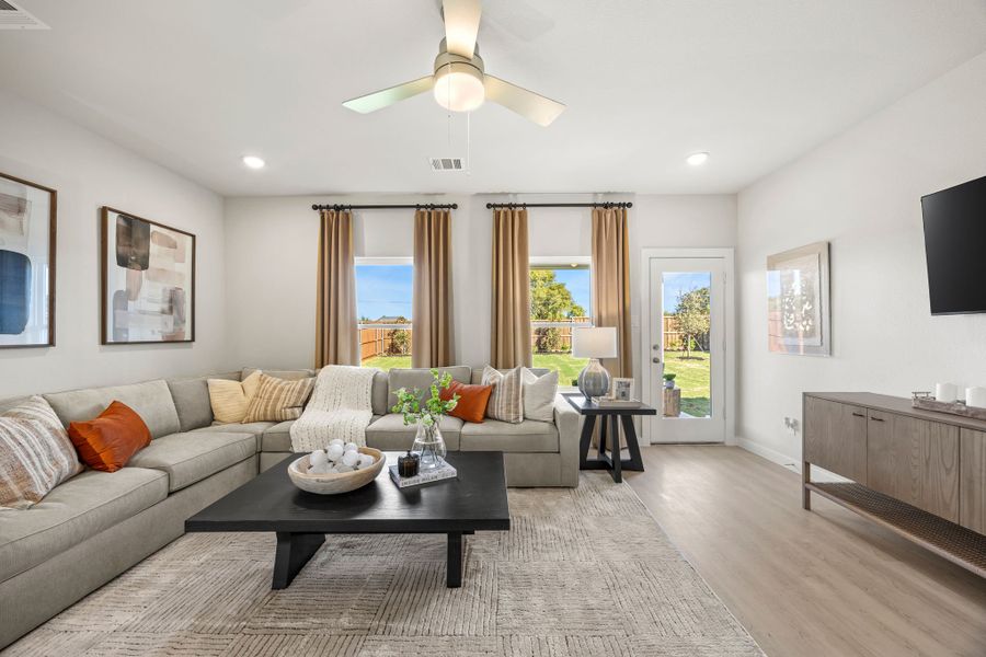 A living room with a large window. A living room with a large window.