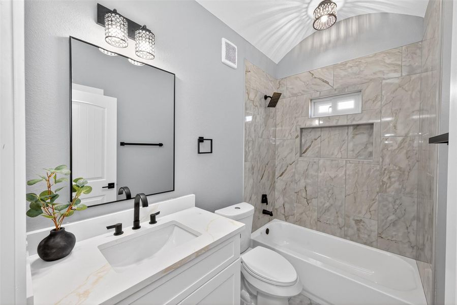 Full bathroom featuring quality finishes and a functional layout. Full bathroom featuring quality finishes and a functional layout.