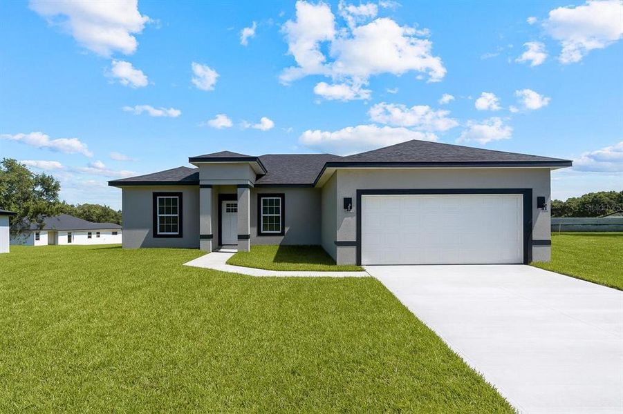 Front exterior of a new home in , Ocala, FL, highlighting curb appeal (Image 1).