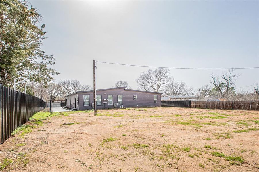 View of yard featuring a fenced backyard