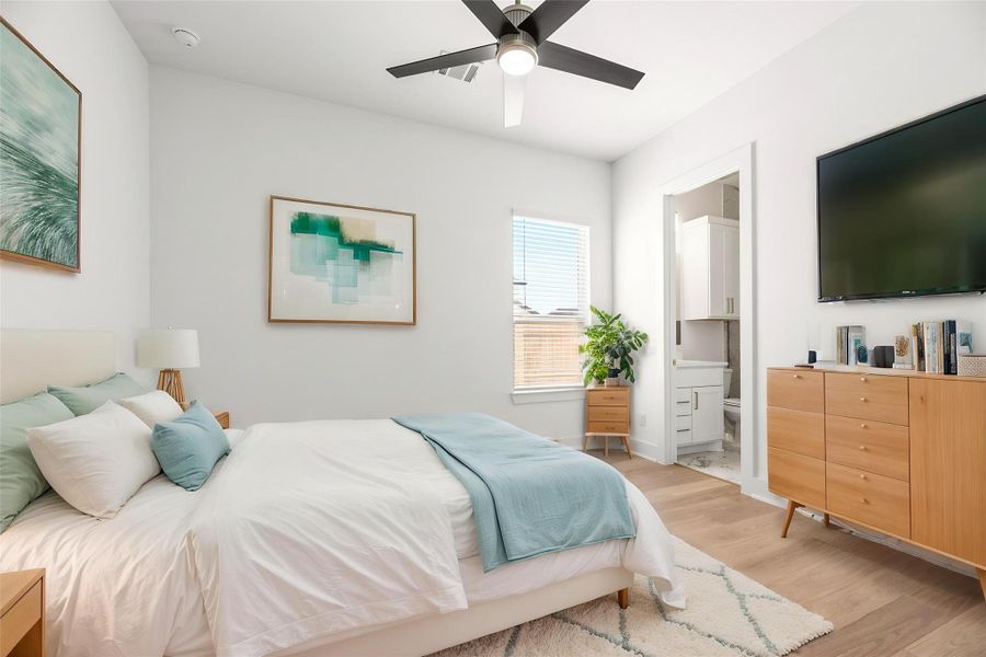 Ideally located on the first floor, this secondary bedroom offers flexibility as a private guest suite or quiet home office, featuring neutral tones and quality finishes. Virtually staged.