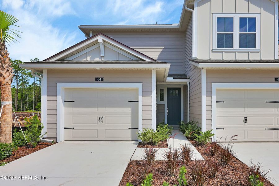 Front exterior of a new home in Woodland Park, Ponte Vedra, FL, highlighting curb appeal (Image 24).