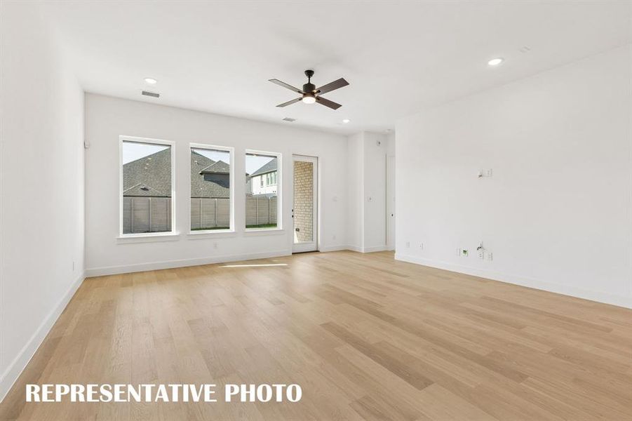 Memories are waiting to be made in this spacious, light filled family room.  REPRESENTATIVE PHOTO