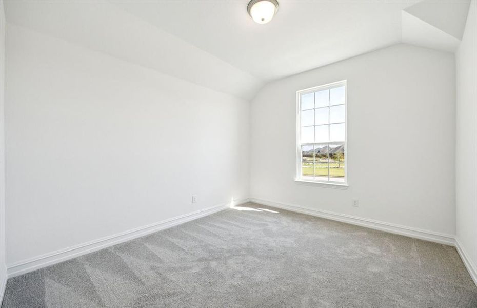 Spacious secondary bedroom with large windows