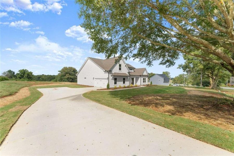 Front exterior of a new home in , Maysville, GA, highlighting curb appeal (Image 26). Front exterior of a new home in , Maysville, GA, highlighting curb appeal (Image 26).