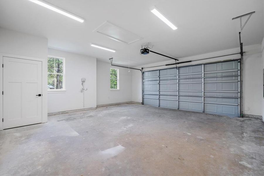 Garage featuring a garage door opener Garage featuring a garage door opener