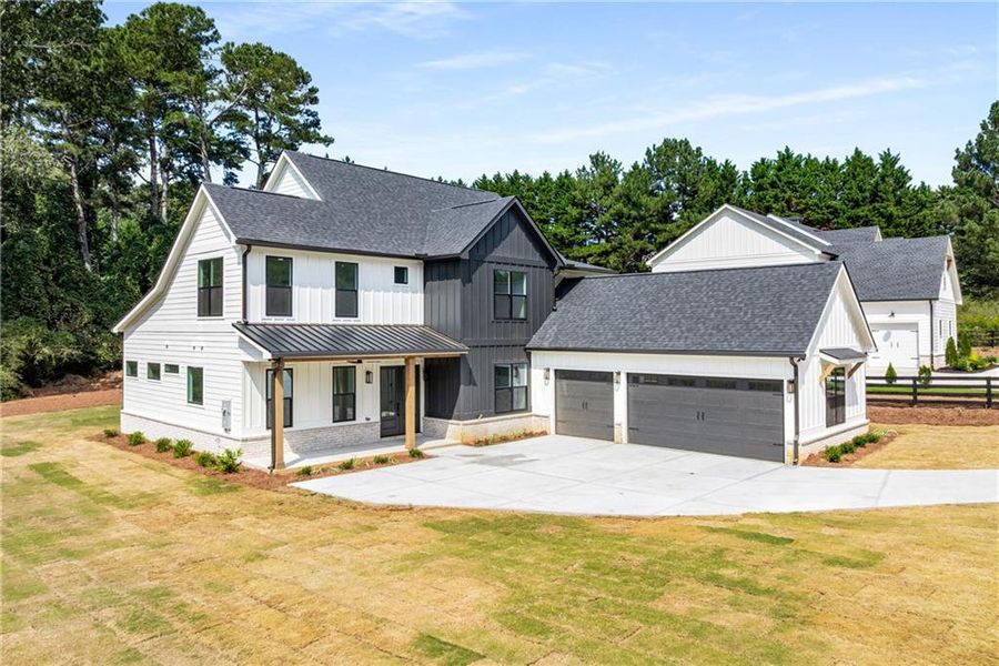 Front exterior of a new home in , Alpharetta, GA, highlighting curb appeal (Image 26). Front exterior of a new home in , Alpharetta, GA, highlighting curb appeal (Image 26).