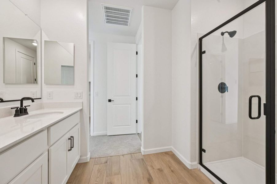 Primary bath. Finishes and options may vary by community.