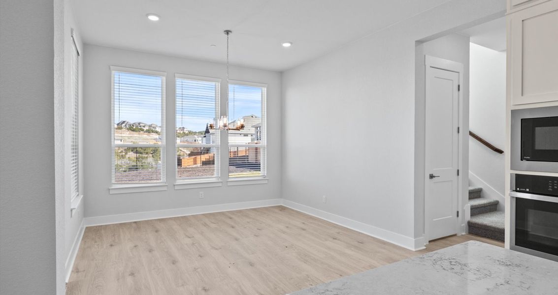 Representative unfurnished interior of a home built from the Raegan by Chesmar Homes in Sweetwater, Austin (Image 10).