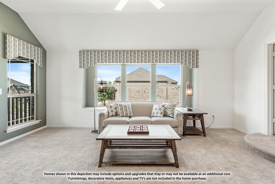Living room with beige sofa, wood coffee table, carpet flooring, and large windows with valances Living room with beige sofa, wood coffee table, carpet flooring, and large windows with valances