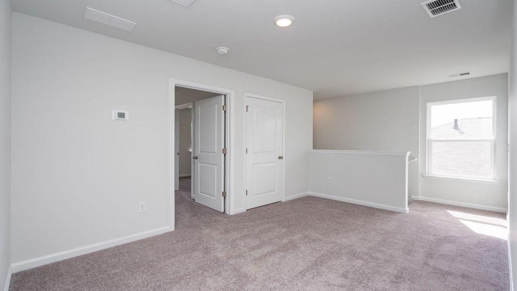 Representative unfurnished interior of a home built from the ROBIE by D.R. Horton in Island Green, Myrtle Beach (Image 34).