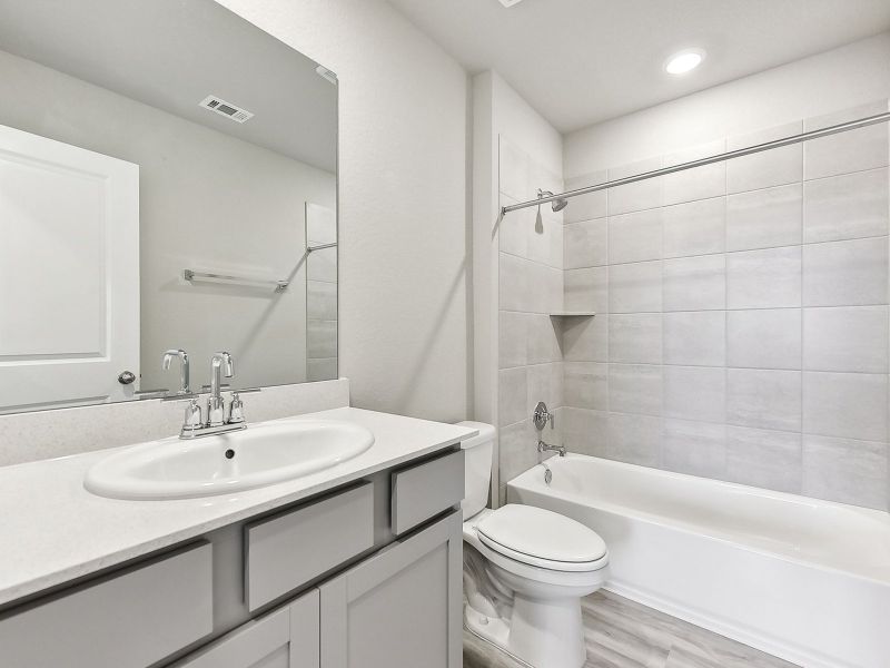 The full secondary bathroom helps make getting ready easier for everyone.