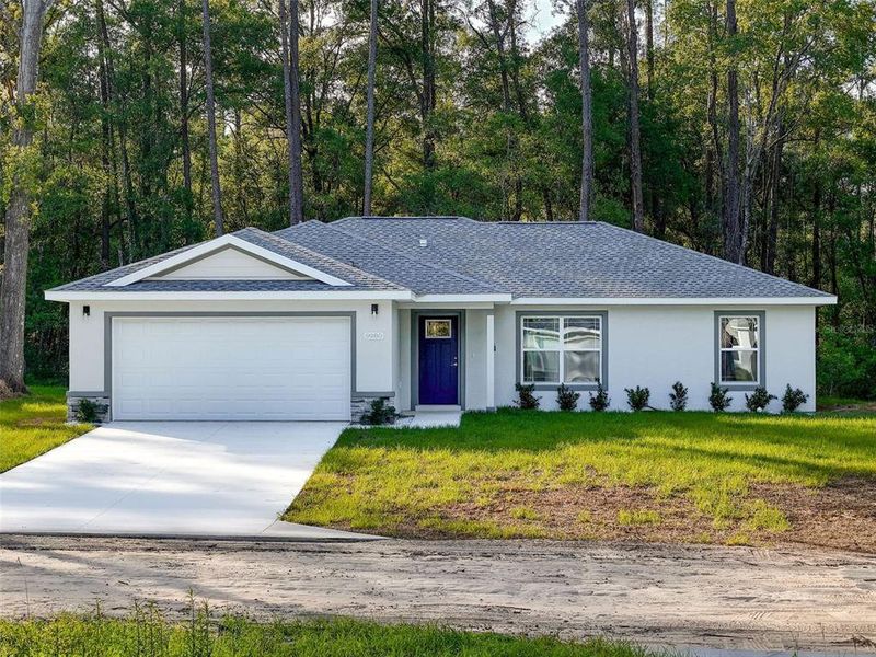 Front exterior of a new home in , Dunnellon, FL, highlighting curb appeal (Image 2).