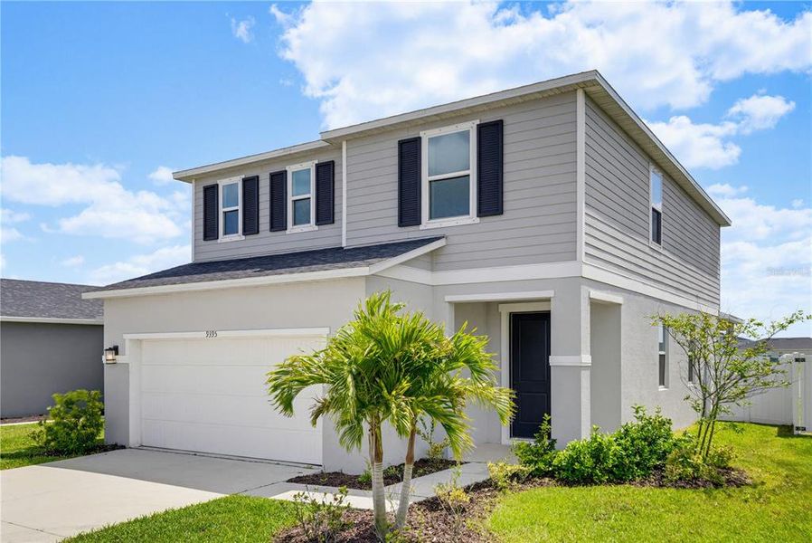 Front exterior of a new home in , Parrish, FL, highlighting curb appeal (Image 27).