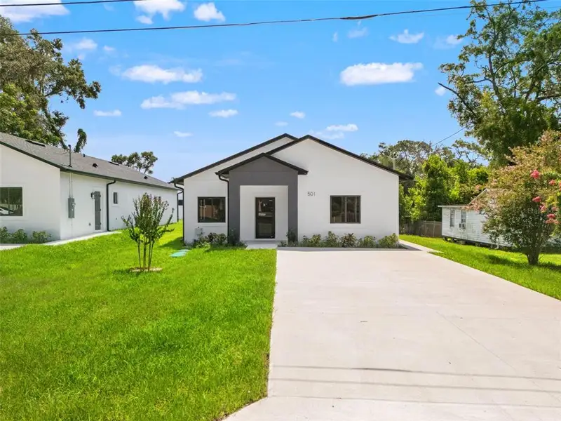 Front exterior of a new home in , Apopka, FL, highlighting curb appeal (Image 21). Front exterior of a new home in , Apopka, FL, highlighting curb appeal (Image 21).