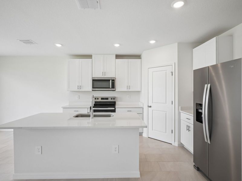 Furnished interior view inside a new home in The Reserve at Van Oaks, Auburndale (Image 5).