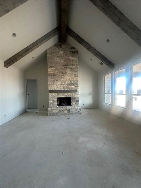 Living with fireplace and stained beams