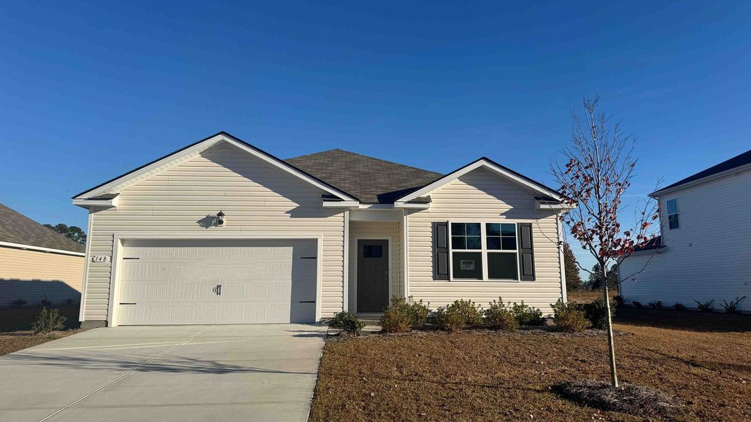 Front exterior of a new home in Preserve at Cypress Commons, Conway, SC, highlighting curb appeal (Image 1). Front exterior of a new home in Preserve at Cypress Commons, Conway, SC, highlighting curb appeal (Image 1).