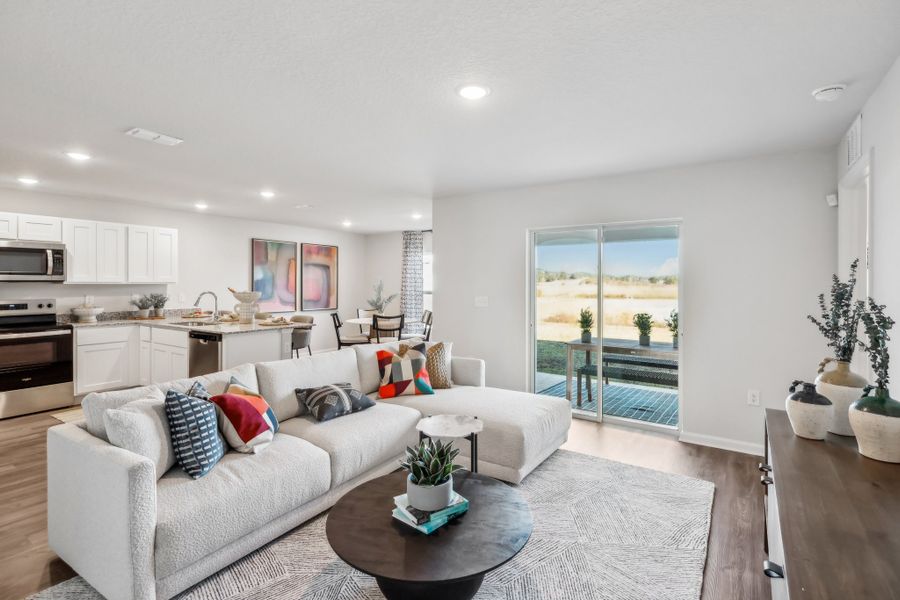 Great room opens to the kitchen and dining area.