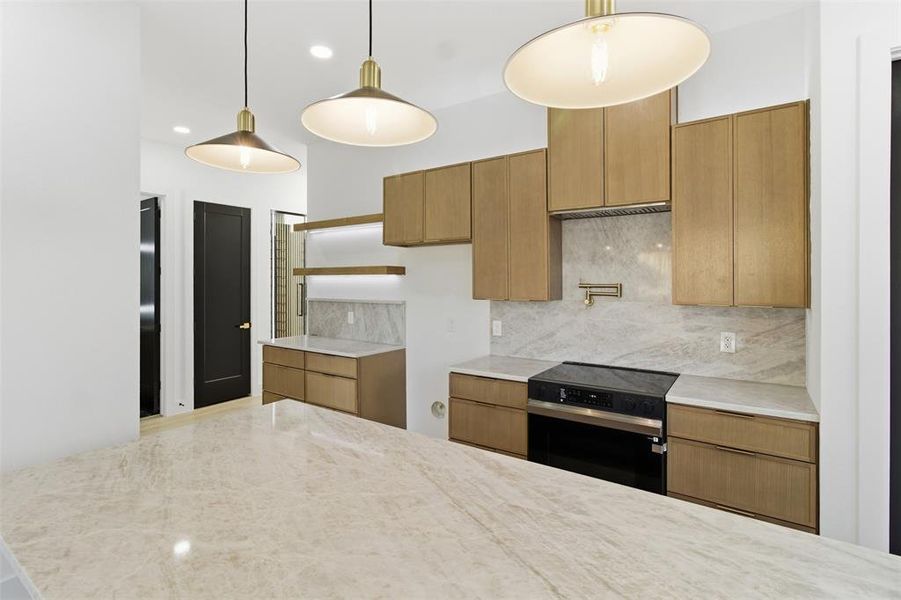 Kitchen featuring decorative backsplash, black electric range, open shelves, light stone countertops, and hanging light fixtures