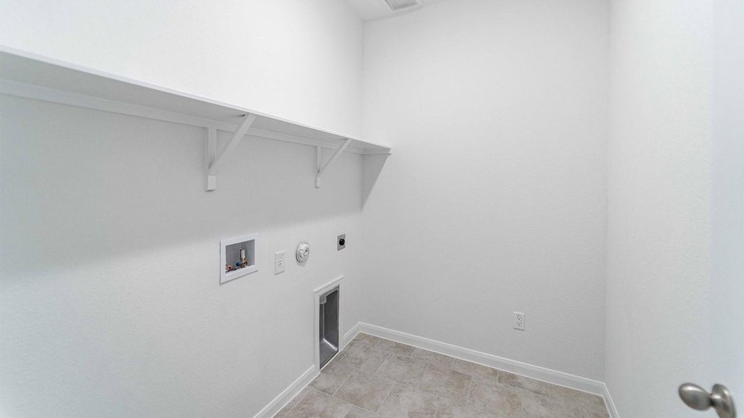 Washroom featuring gas dryer hookup, hookup for an electric dryer, and washer hookup