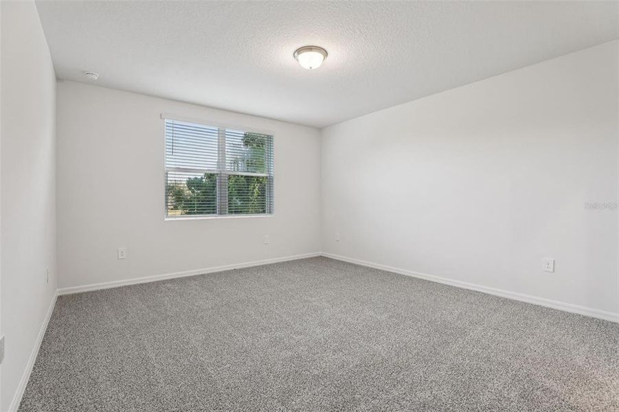 Spacious, unfurnished interior of a new home in Bradbury Creek - Signature Series, Haines City (Image 23).