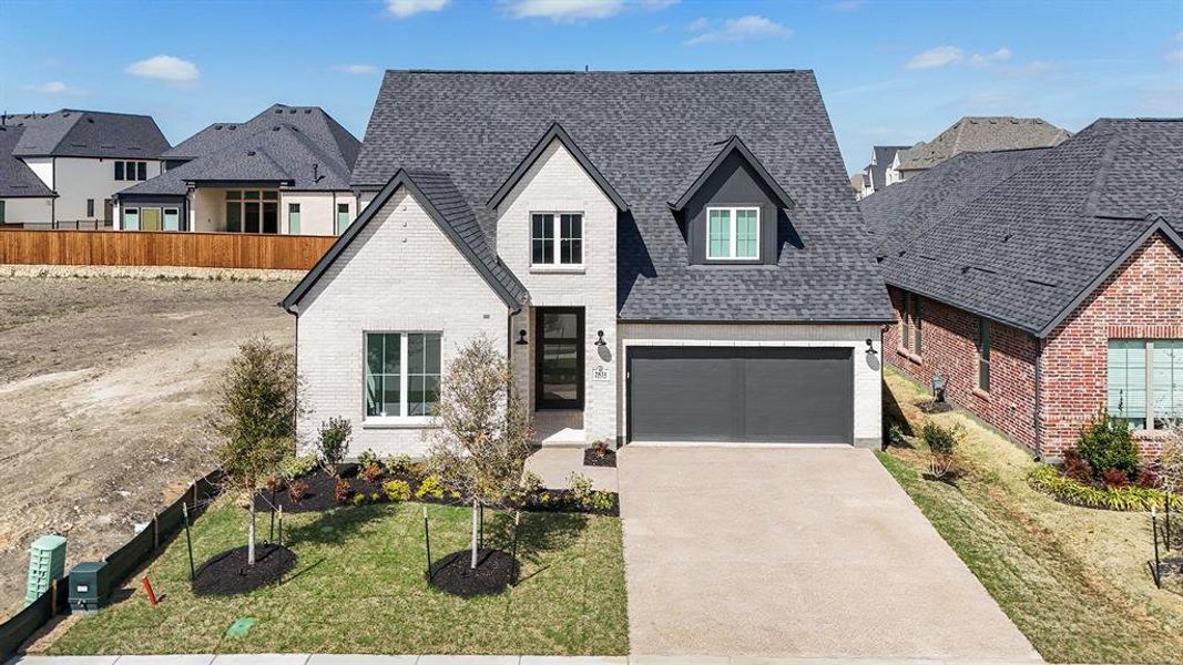 Front exterior of a new home in Brookhollow West, Prosper, TX, highlighting curb appeal (Image 23).