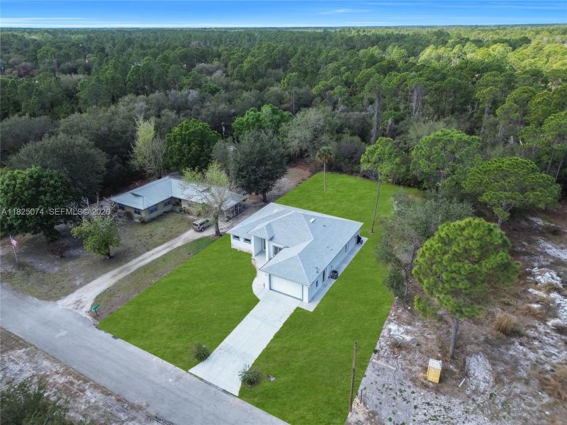 Front exterior of a new home in , Lehigh Acres, FL, highlighting curb appeal (Image 23).