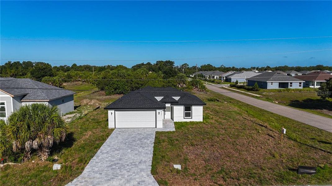 Front exterior of a new home in , North Port, FL, highlighting curb appeal (Image 17).